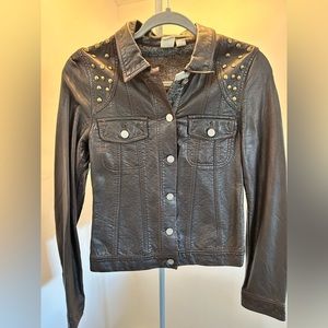 Faux Leather jacket with rivets applications .